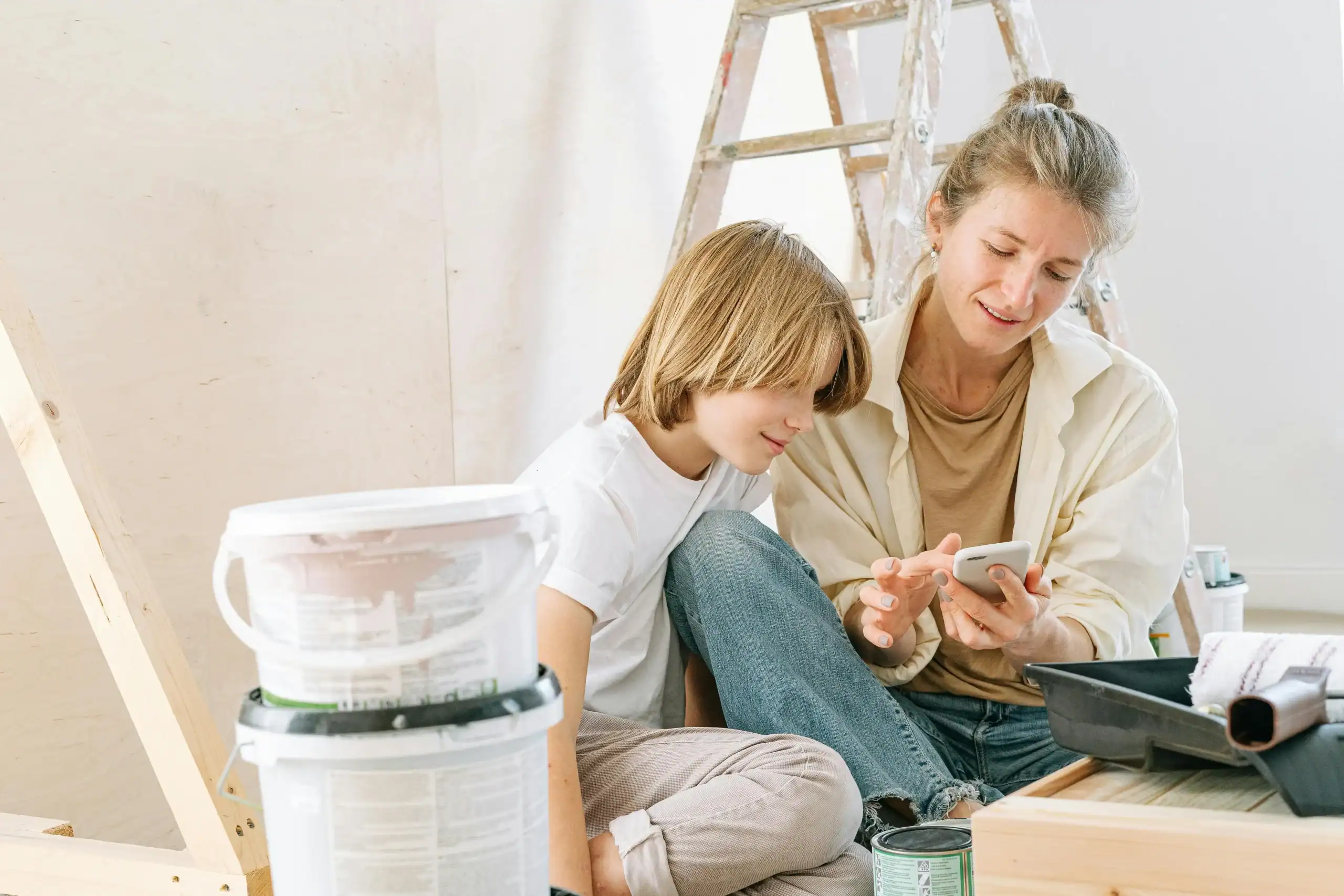 Parents being chore coach for kids while doing housework together