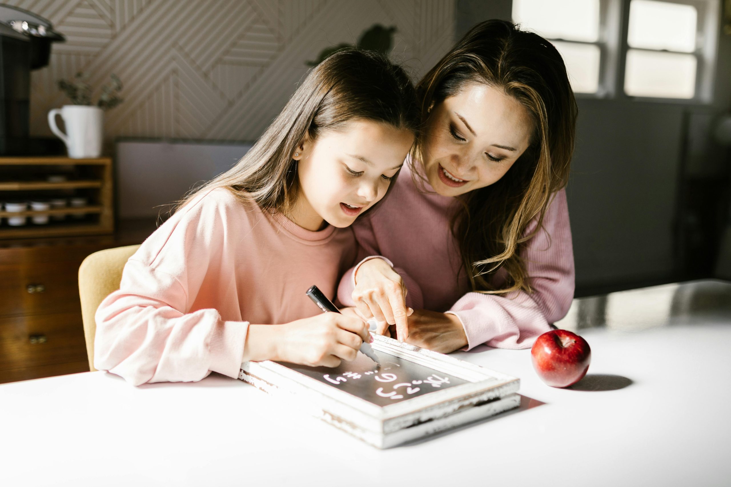 Child practicing pre-writing skills for kids using crayons and tracing lines